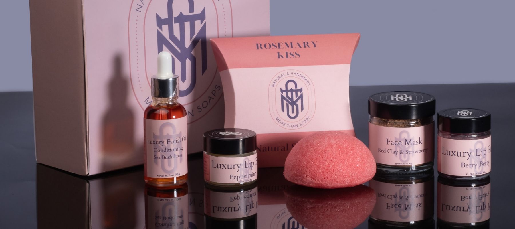 Natural plant-based skincare collection in beautiful 100% recyclable pretension box. Konjac sponge, facial oil, soap, lip balm, body polish scrub, lip polish scrub.  